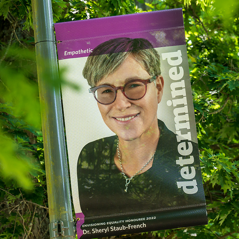 Dr. Sheryl Staub-French, pictured on a purple banner