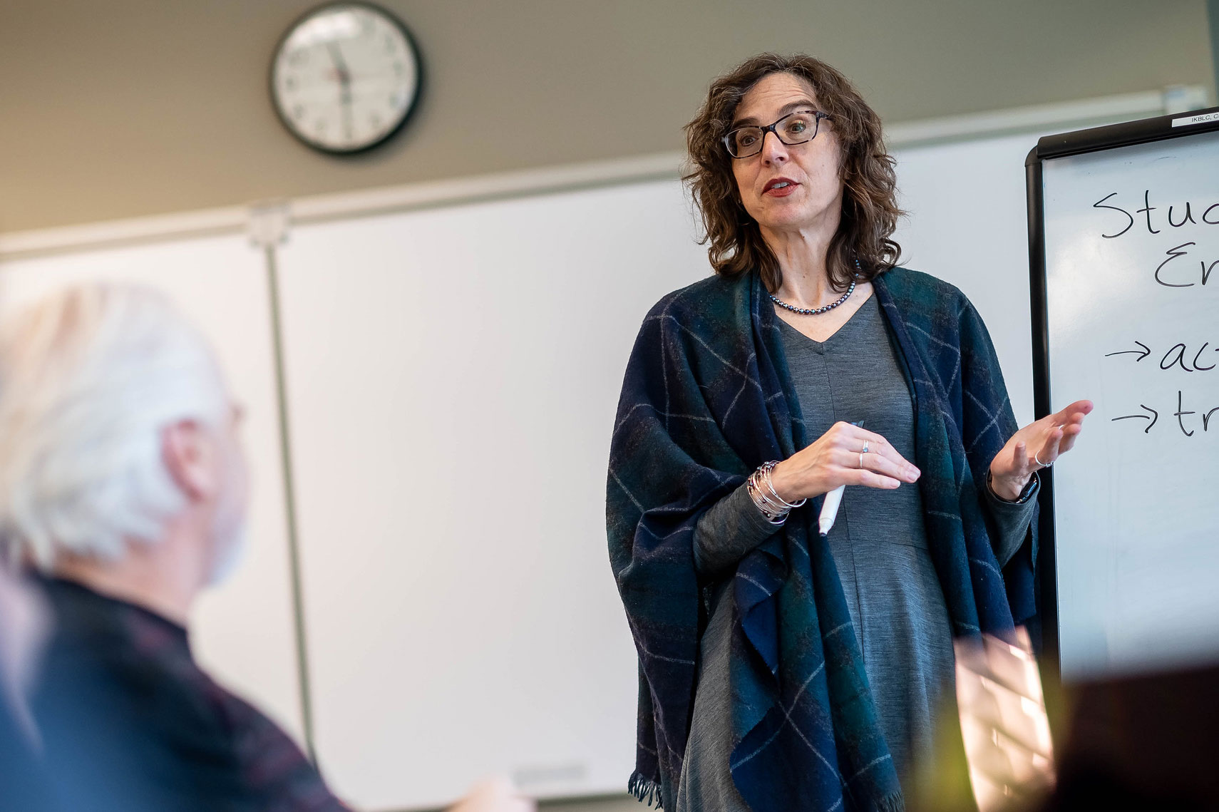 Dr. Christina Hendricks, Academic Director for the Centre for Teaching, Learning, and Technology, and Professor of Teaching in the Department of Philosophy, stands in front of a white board giving a presentation.