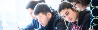 Students talking with a professor at UBC's Vantage College
